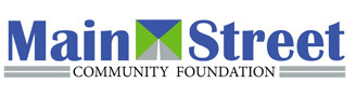 Logo of Main Street Community Foundation consisting of the text "Main Street" split by an image featuring a blue top triangle and a green bottom triangle, forming a street heading off into the distance under a blue sky, and "Community Foundation" underneath in smaller text.